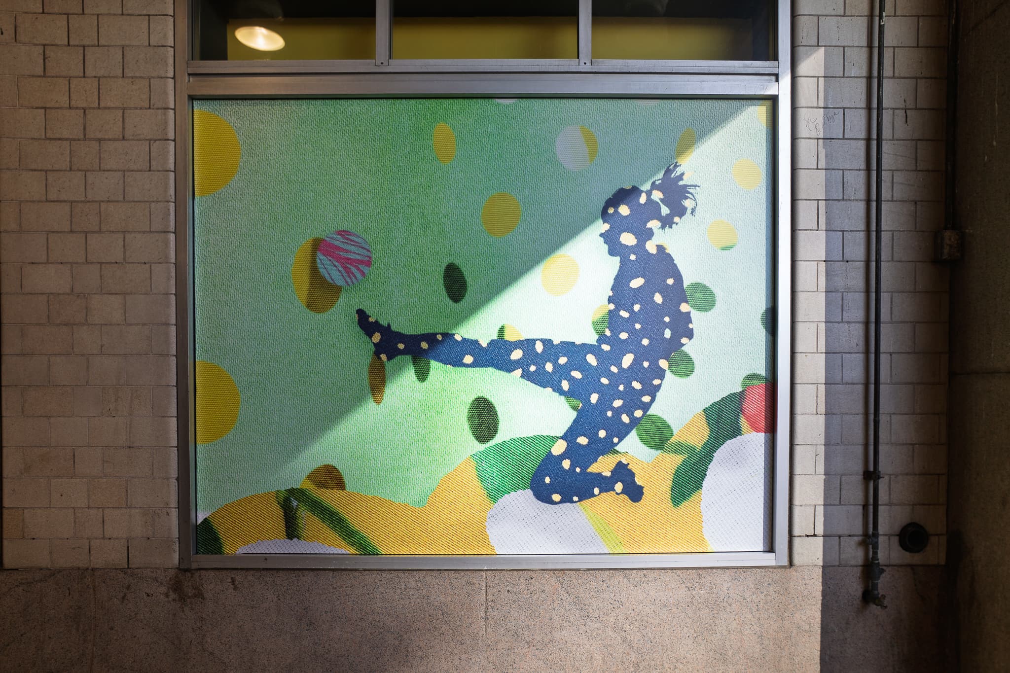 A Field of Many Threads by Eirini Linardaki placed on retail windows for NJ Transit