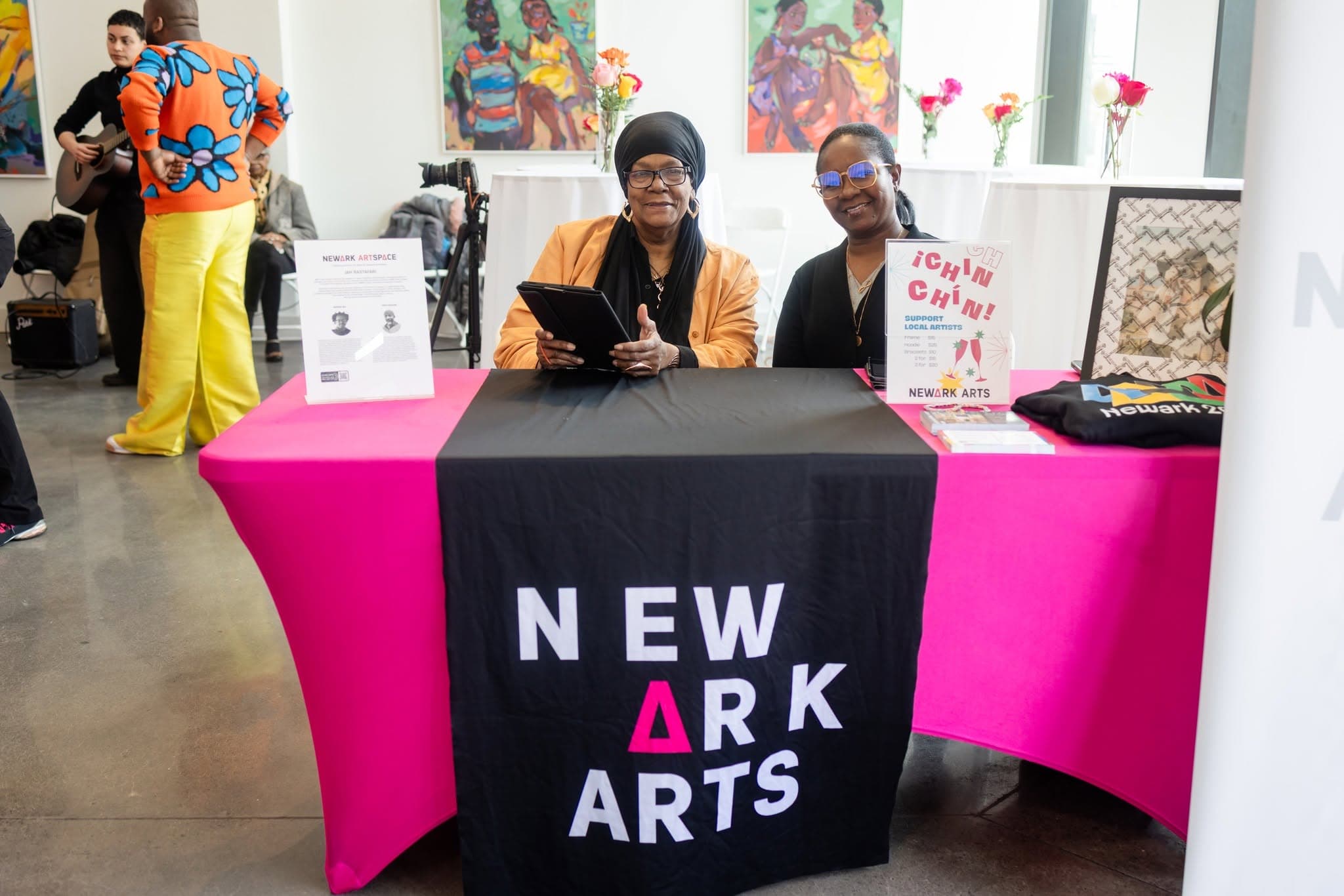 Volunteers at welcome table for Love, Newark Arts fundraiser